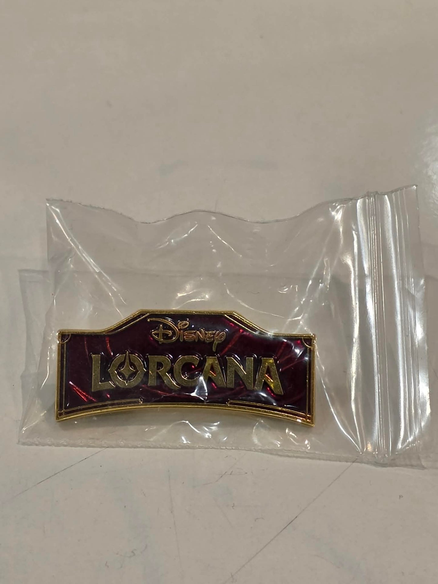 Lorcana TCG - League Pin for Ursulas Return - Ruby